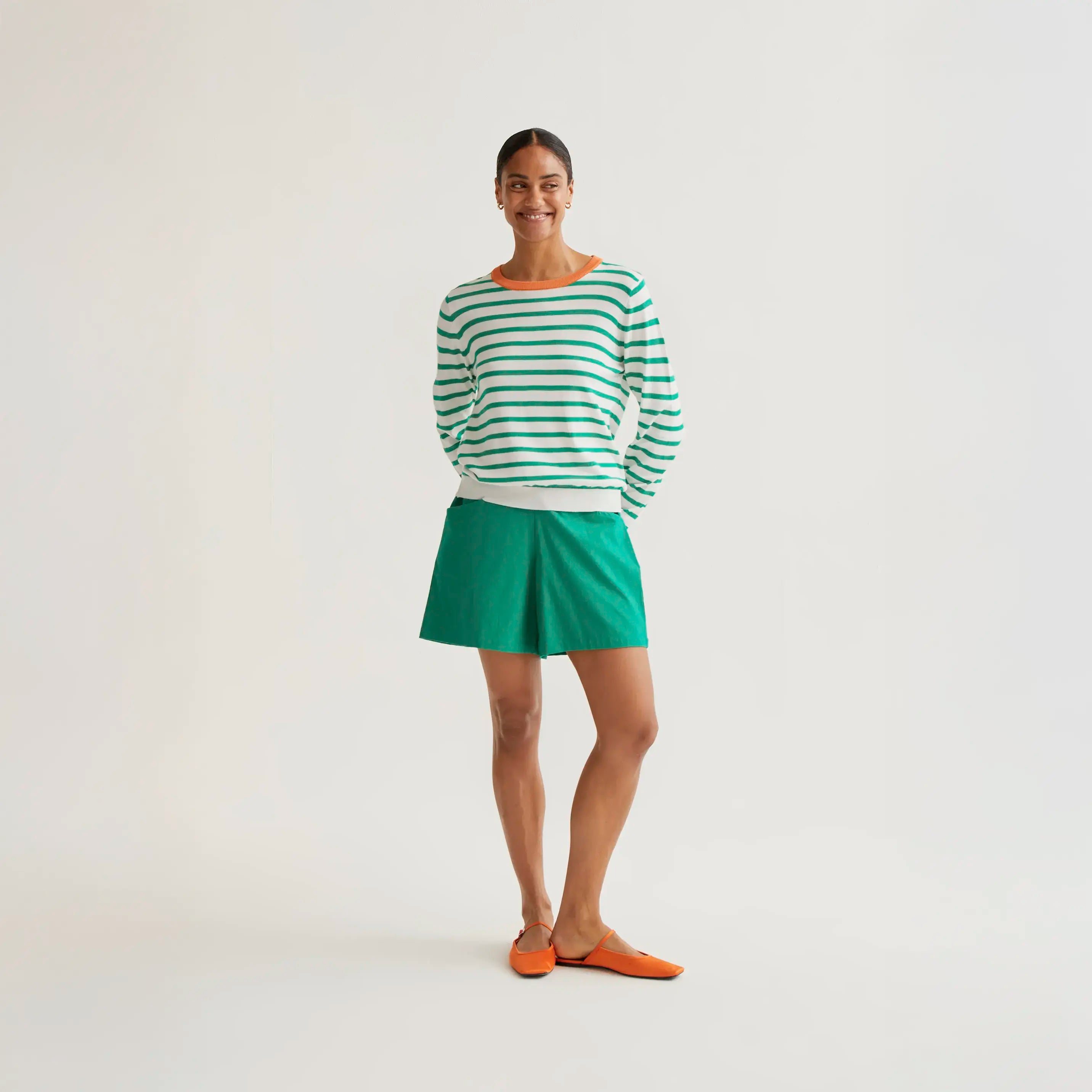 Knitted sweater with white and green striped print