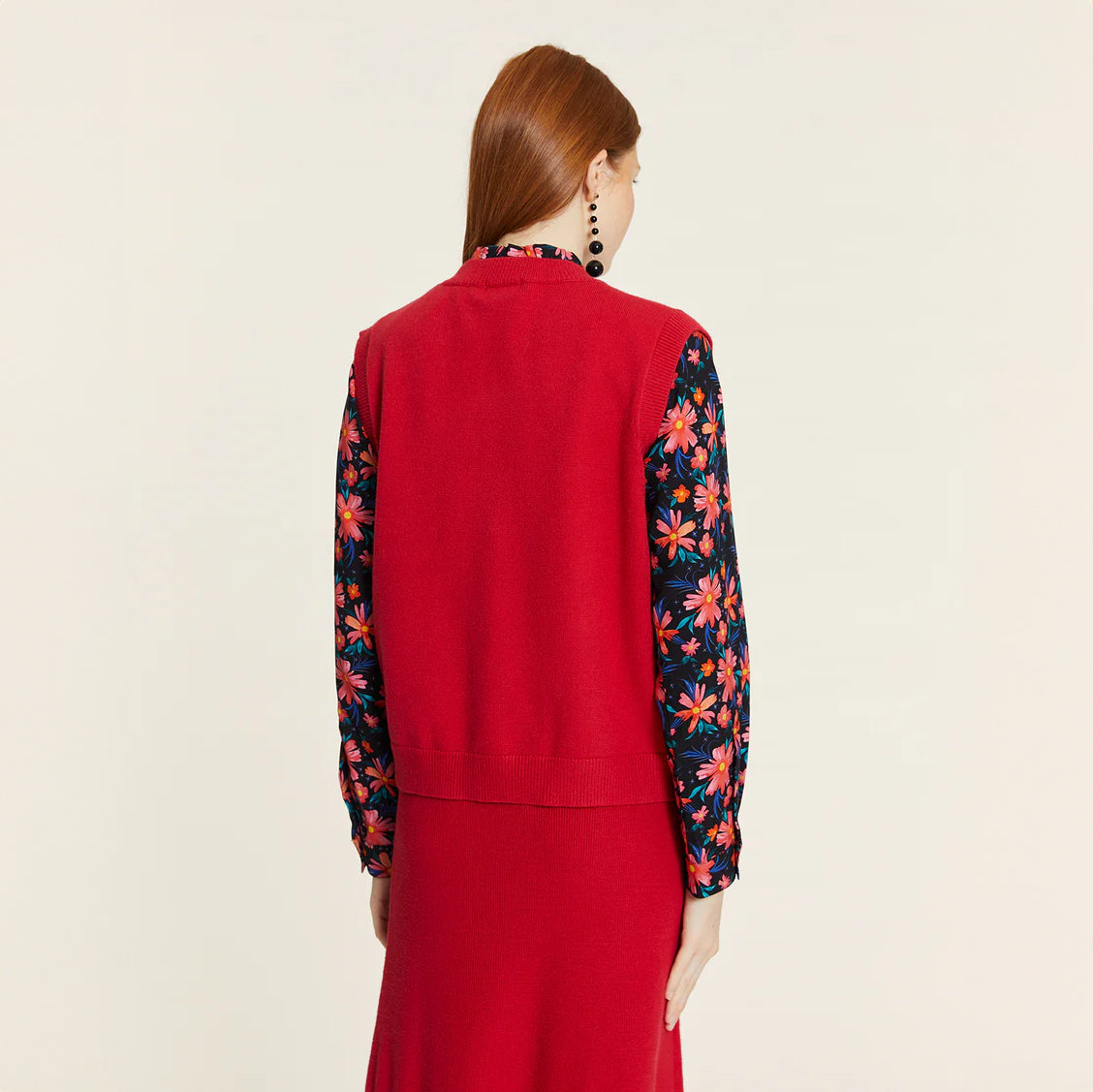 Knitted vest with red heart buttons